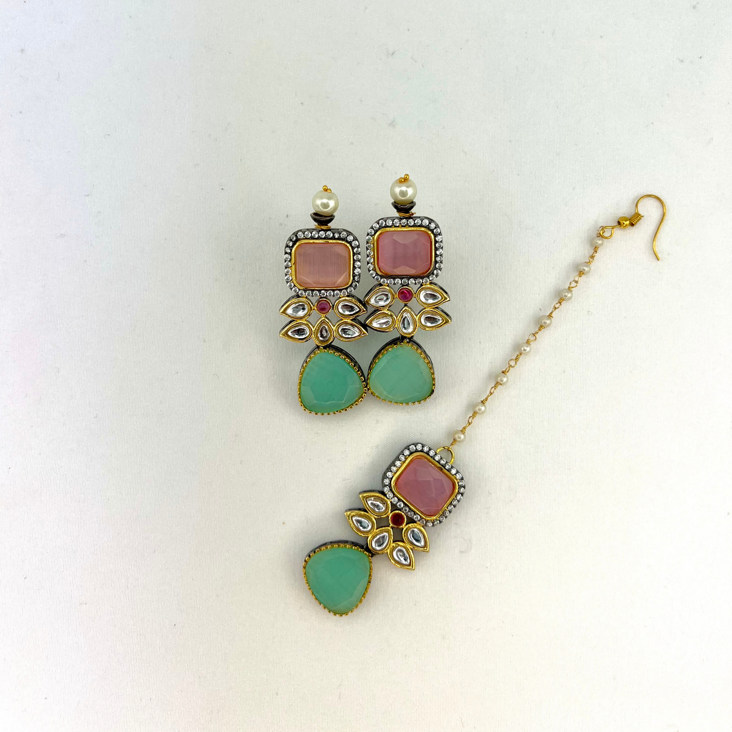 Necklace set with green, pink and silver stone work finished with small white pearls. Set includes necklace, tikka and earrings. Prefect for Indian parties, weddings and special occasions. Latest 2022 fashion