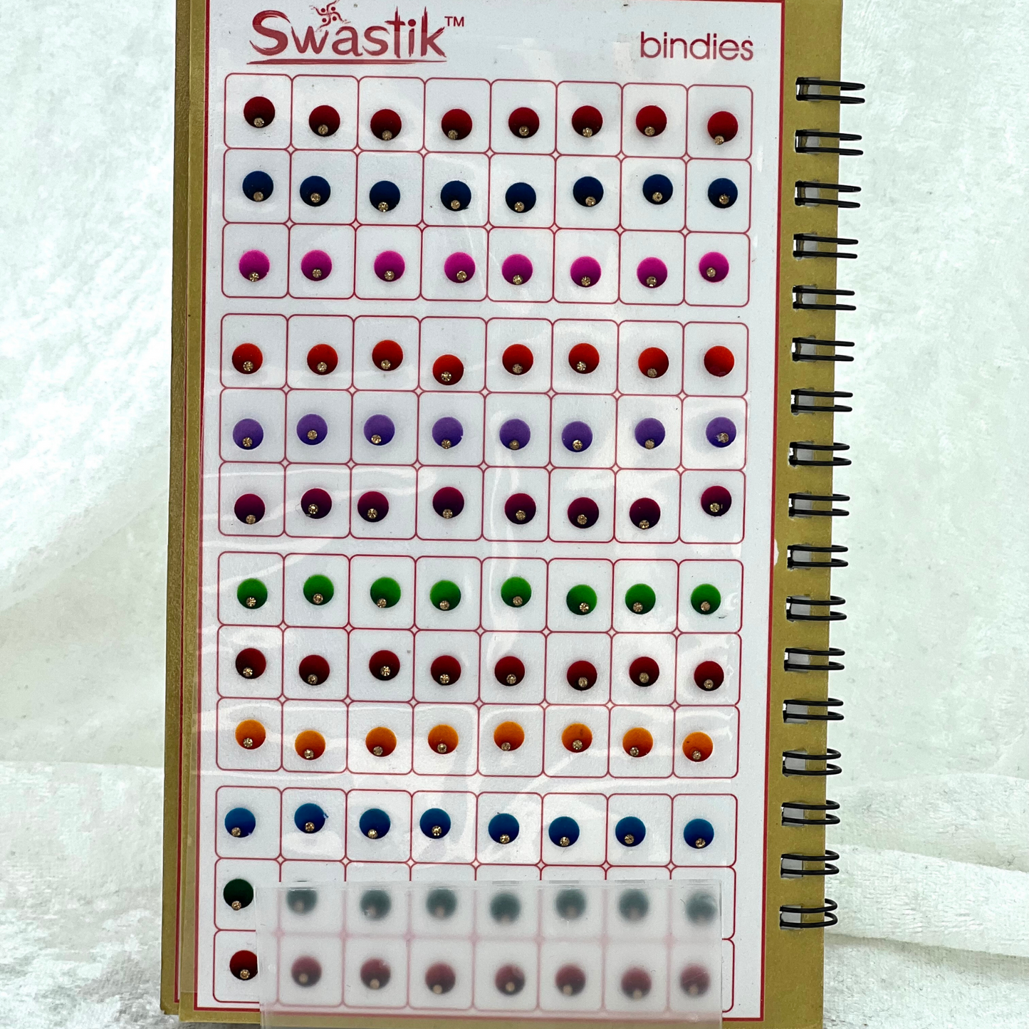Bindi Book with single gold stone work in round shape in various different sizes and colours. Prefect for Indian weddings, parties and special occasions.