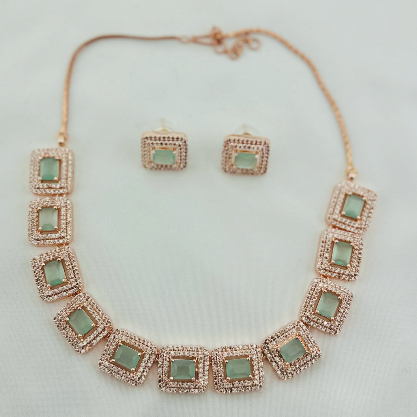 Rosegold necklace set with light blue and clear stones. Set includes necklace & earrings. Prefect for Indian weddings, parties and special occasions. Latest 2023 fashion. High end Indian fashion jewellery with top quality stones and beads.
