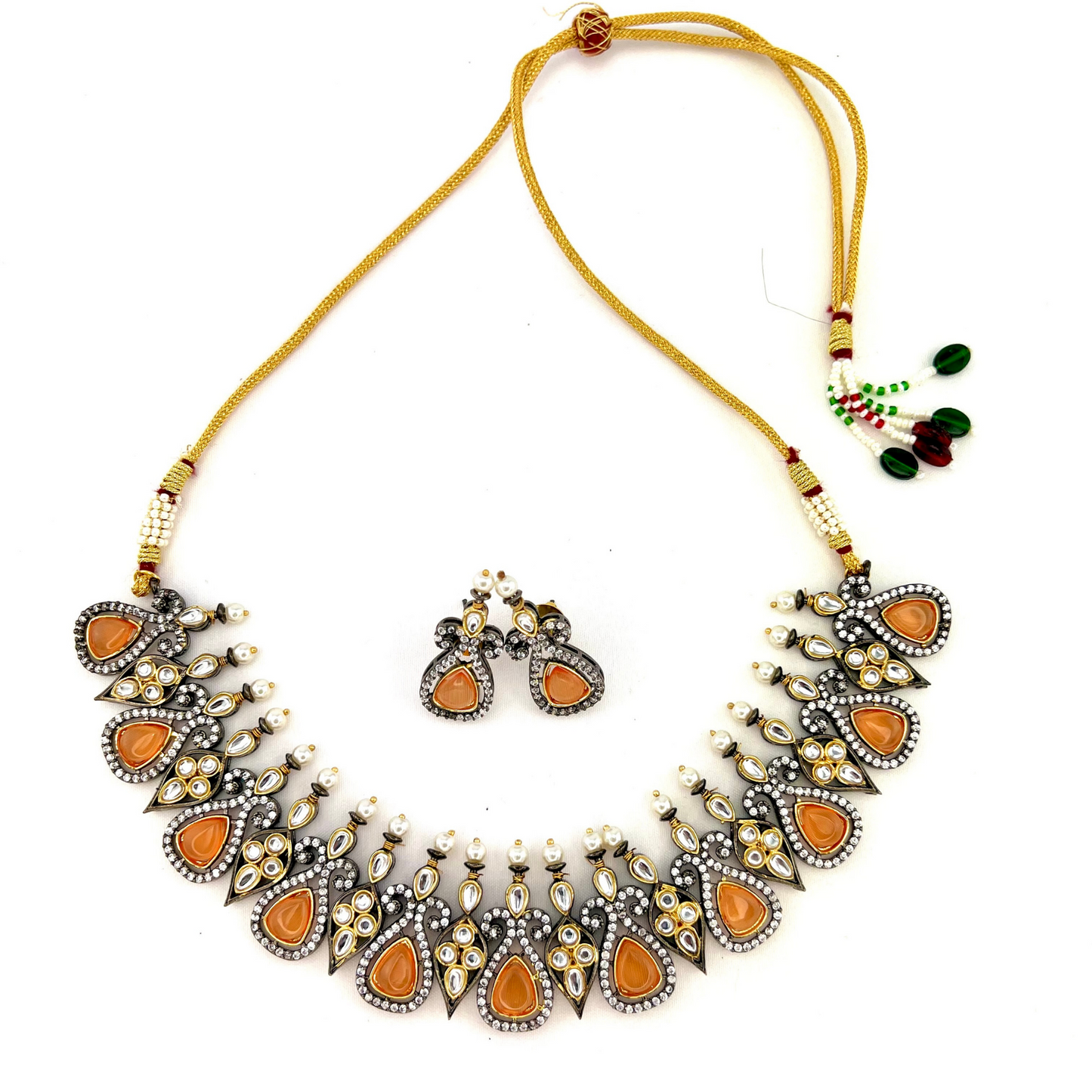 Necklace set with peach and clear stone work. Set includes necklace and earrings. Prefect for Indian weddings, parties and special occasions. Latest 2022 fashion. High end Indian fashion jewellery with top quality stones and beads.
