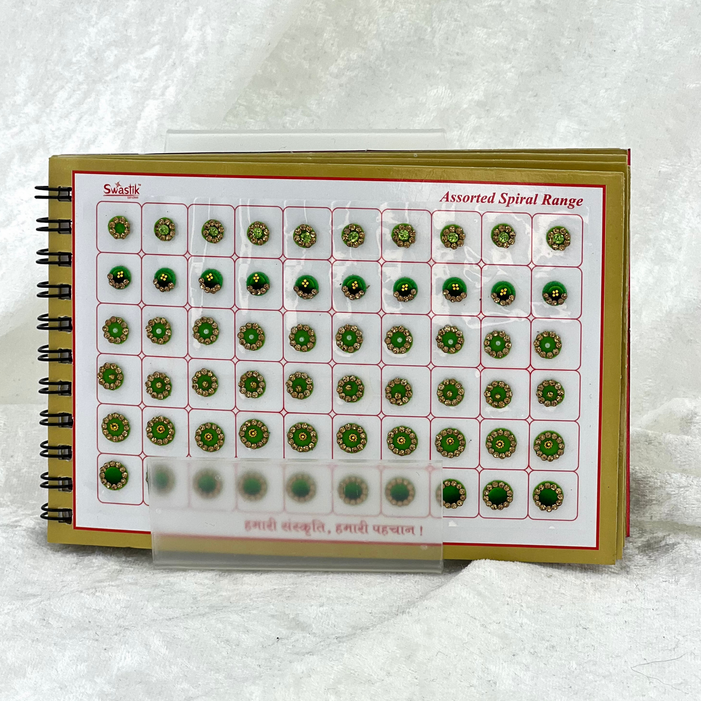 Bindi Book with gold stone work in round shape in various different sizes and colours. Prefect for Indian weddings, parties and special occasions.