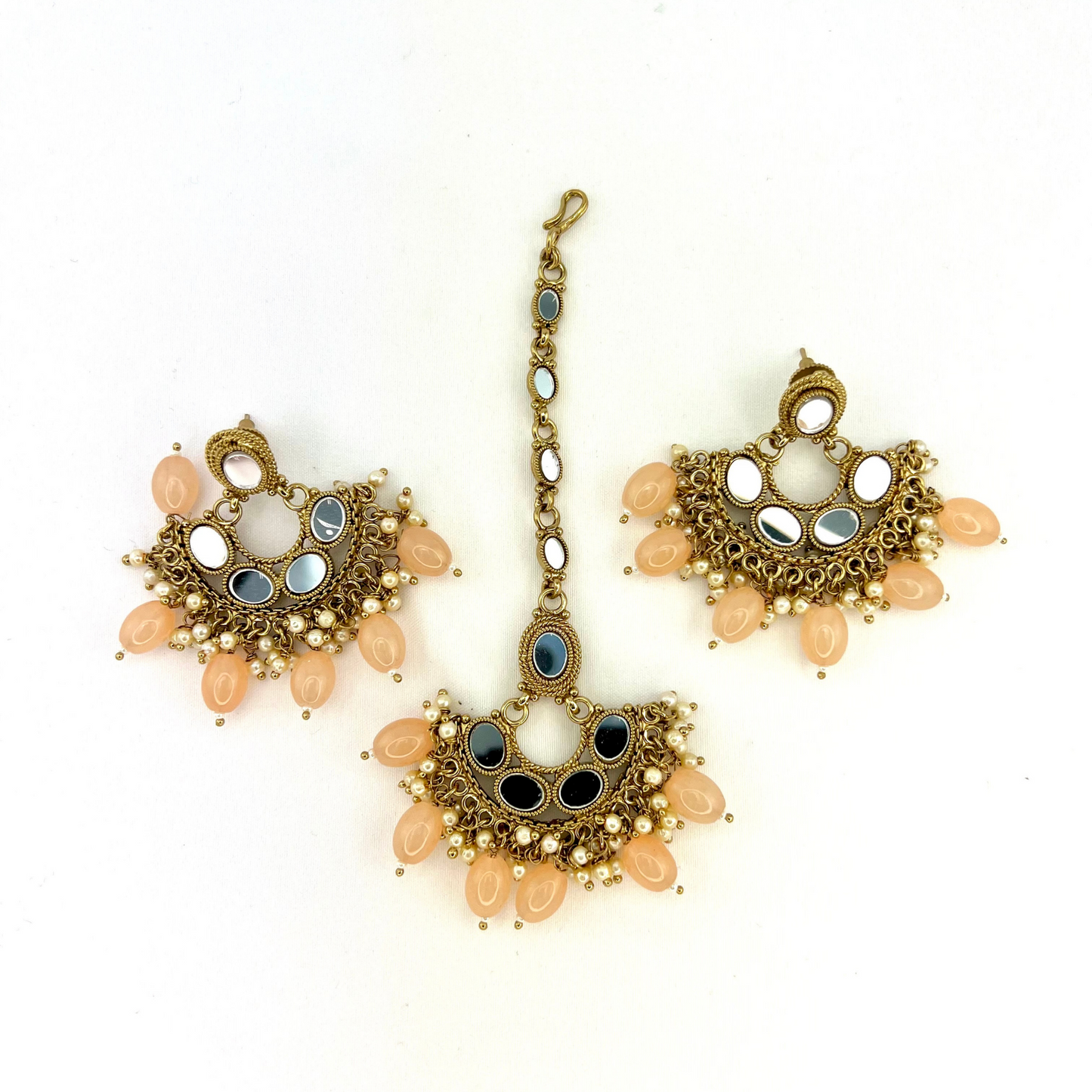 Mirror necklace set with peach beads and small white pearls. Set includes necklace, tikka and earrings. Prefect for Indian parties, weddings and special occasions. Latest 2022 fashion.