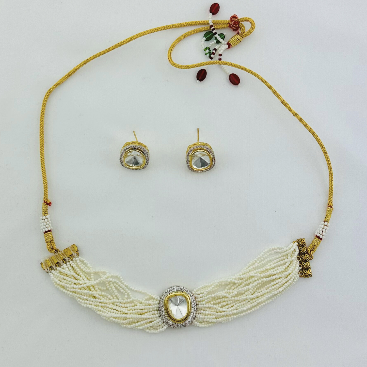 Necklace set with clear stone and white pearl beads. Set includes necklace & earrings. Prefect for Indian weddings, parties and special occasions. Latest 2023 fashion. High end Indian fashion jewellery with top quality stones and beads.