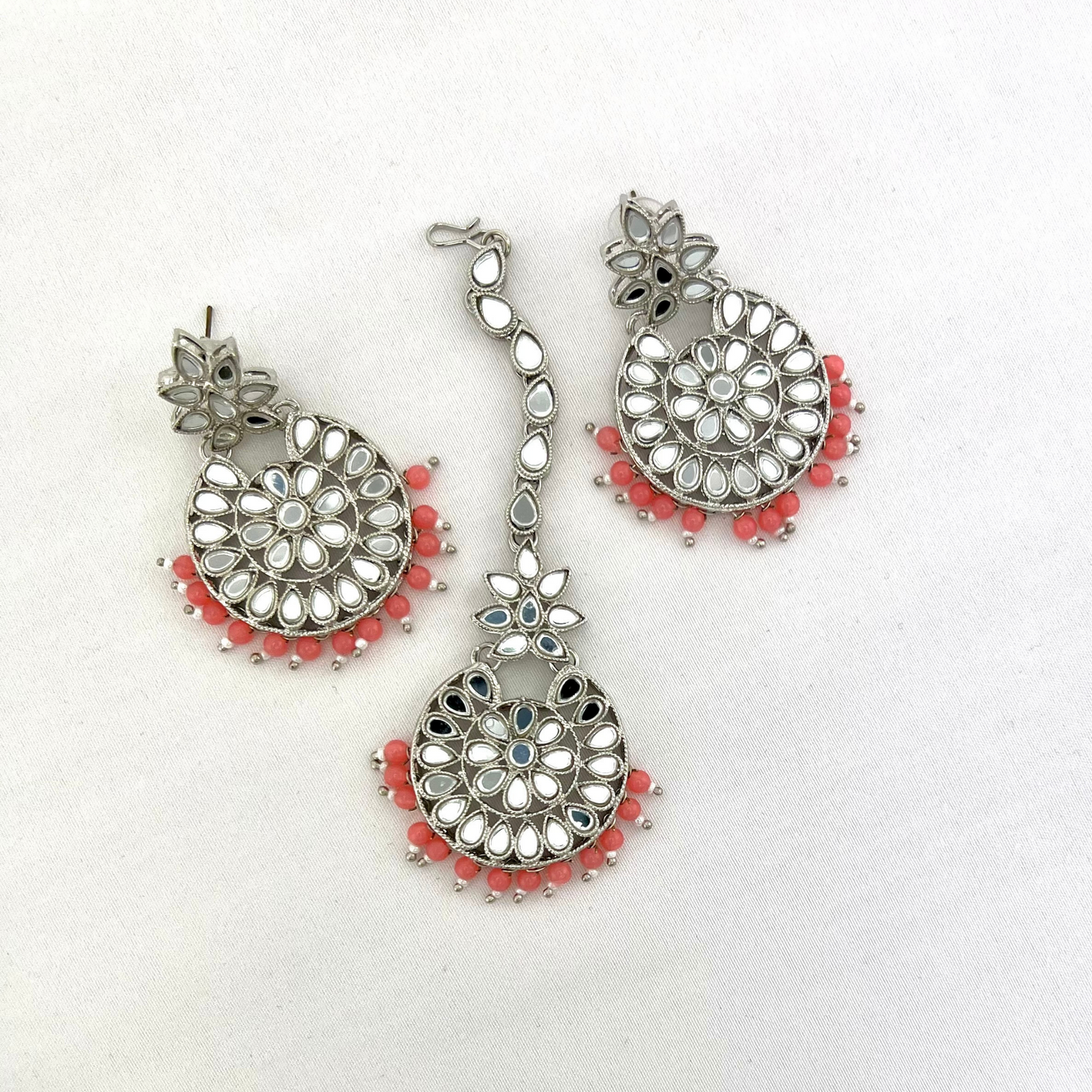 Mirror necklace set with pink beads. Set includes, necklace, tikka and earrings. Prefect for Indian weddings, parties and special occasions. Latest 2022 fashion. High end Indian fashion jewellery with top quality stones and beads.