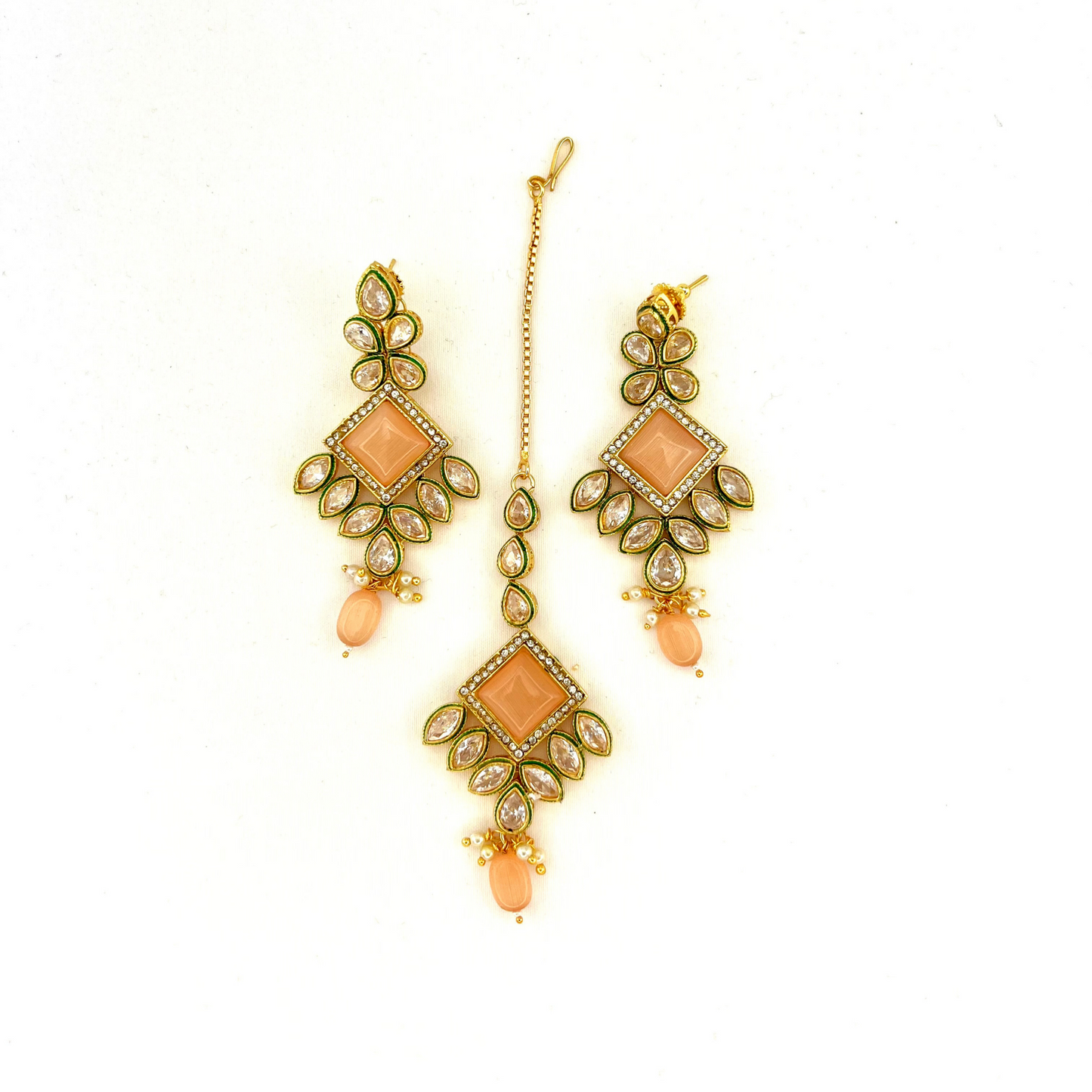 Necklace set with peach beads and peach and clear stone. Set includes necklace, tikka & earrings. Prefect for Indian weddings, parties and special occasions. Latest 2022 fashion. High end Indian fashion jewellery with top quality stones and beads.