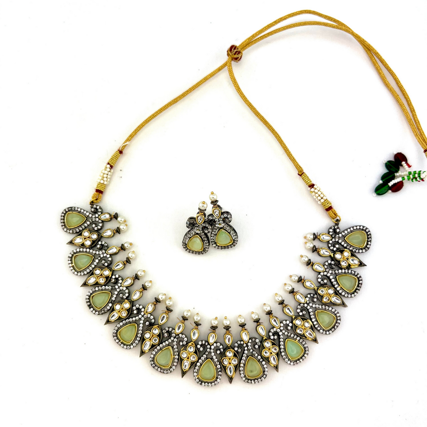 Necklace set with mint green and clear stone work. Set includes necklace and earrings. Prefect for Indian weddings, parties and special occasions. Latest 2022 fashion. High end Indian fashion jewellery with top quality stones and beads.