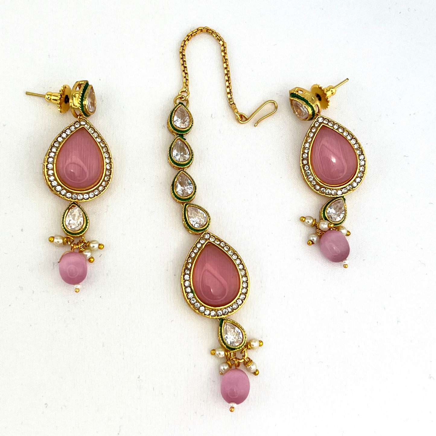 Choker set with pink, clear stones and pink beads. Set includes choker, tikka and earrings. Prefect for Indian weddings, parties and special occasions. Latest 2022 fashion. High end Indian fashion jewellery with top quality stones and beads.