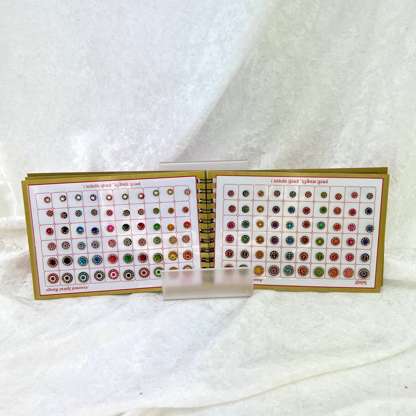 Bindi Book with gold stone work in various different shapes, sizes and colours. Prefect for Indian weddings, parties and special occasions.