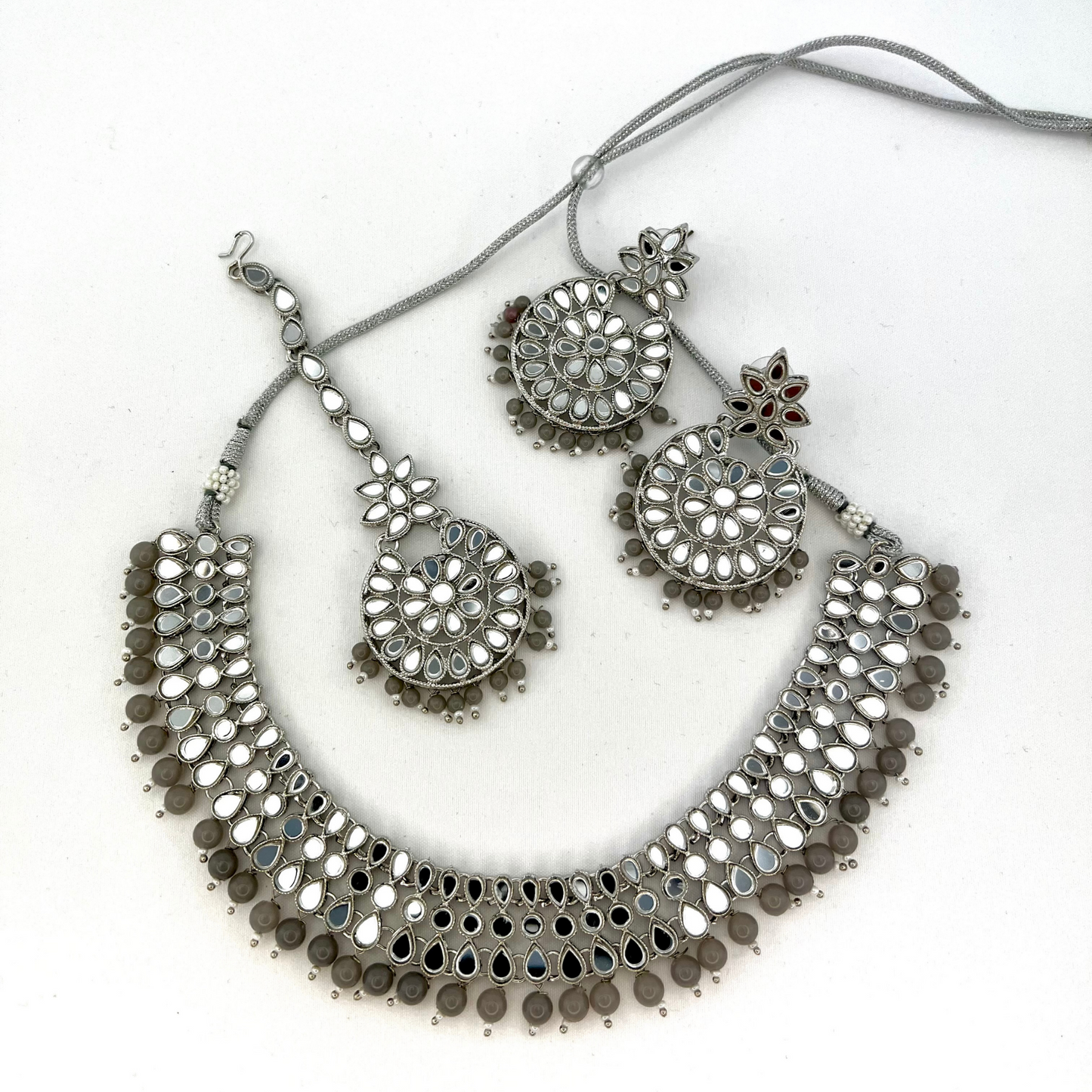 Mirror necklace set with grey beads. Set includes, necklace, tikka and earrings. Prefect for Indian weddings, parties and special occasions. Latest 2022 fashion. High end Indian fashion jewellery with top quality stones and beads.