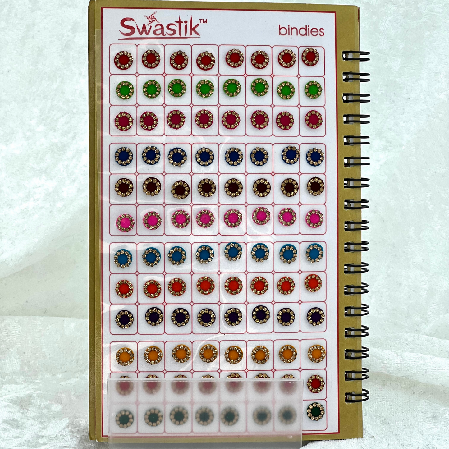 Bindi Book with gold stone work in various different shapes, sizes and colours. Prefect for Indian weddings, parties and special occasions.