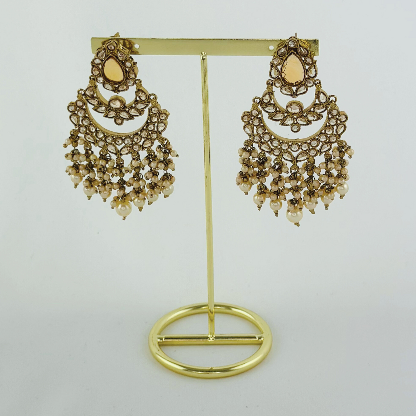 Choker set with bronze stones and white pearl beads. Set includes necklace, tikka & earrings. Prefect for Indian weddings, parties and special occasions. Latest 2023 fashion. High end Indian fashion jewellery with top quality stones and beads.