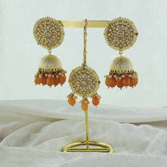 Tikka & earring set in peach. High quality beads, pearls and stone work. Latest 2023 fashion for weddings, parties and special occasions