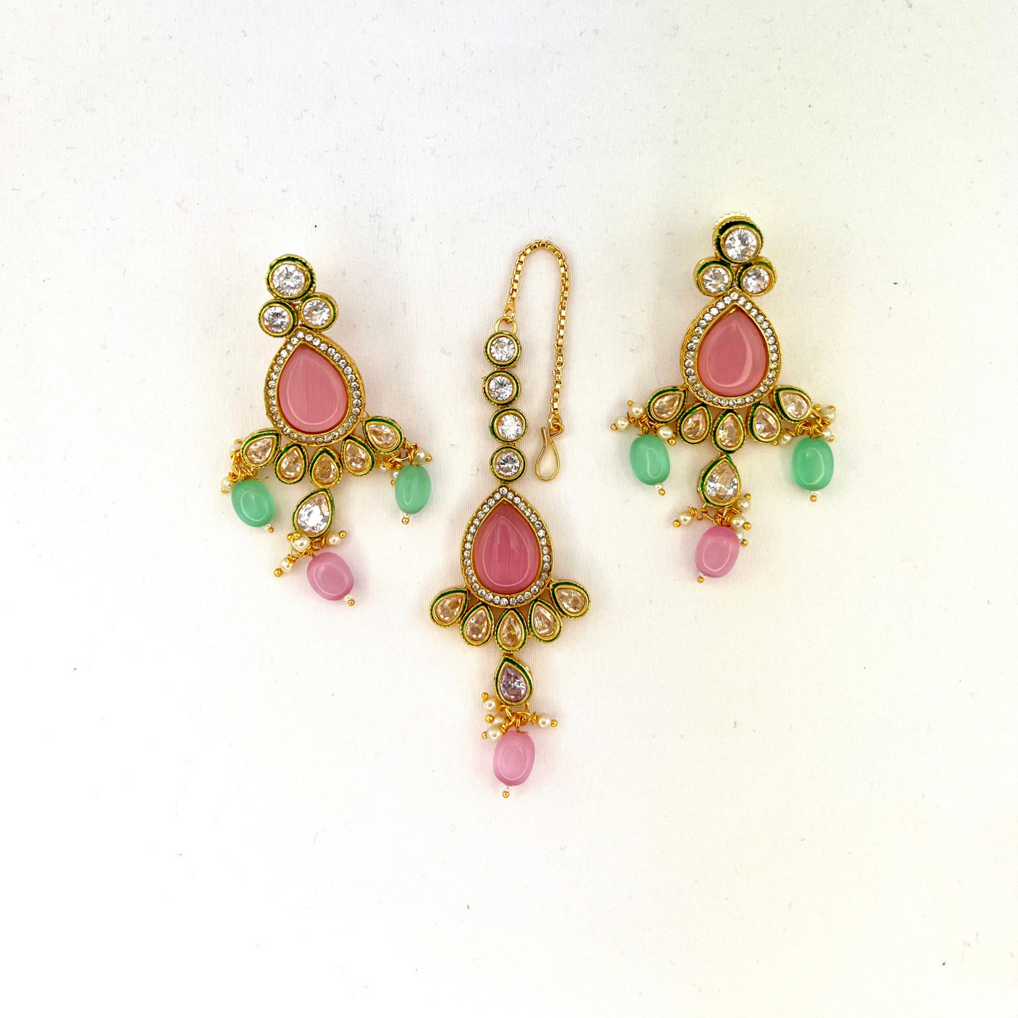 Necklace set with green, pink and clear stones and green and pink beads. Set includes necklace, tikka and earrings. Prefect for Indian weddings, parties and special occasions. Latest 2022 fashion. High end Indian fashion jewellery with top quality stones and beads.