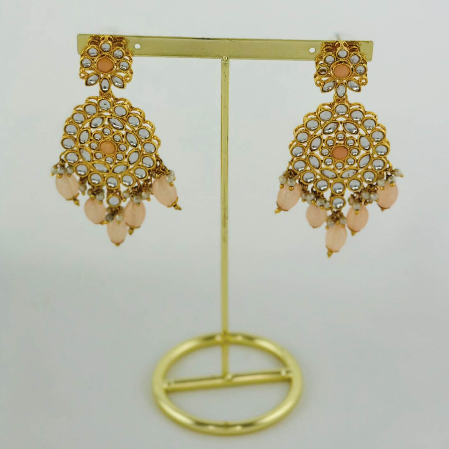Necklace set with peach stones and beads. Set includes necklace, tikka & earrings. Prefect for Indian weddings, parties and special occasions. Latest 2023 fashion. High end Indian fashion jewellery with top quality stones and beads.