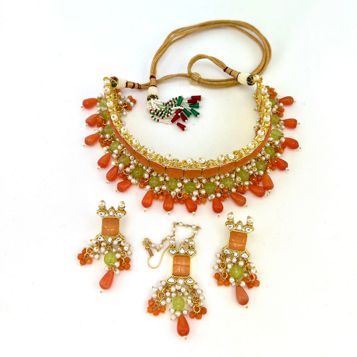 Choker set with with peach, clear stones and green, peach and orange beads, Set includes choker, tikka and earrings. Prefect for Indian weddings, parties and special occasions. Latest 2022 fashion. High end Indian fashion jewellery with top quality stones and beads.