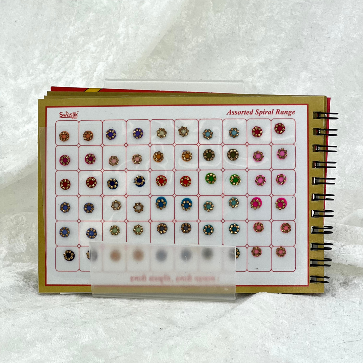 Bindi Book with gold stone work in round shape in various different sizes and colours. Prefect for Indian weddings, parties and special occasions.