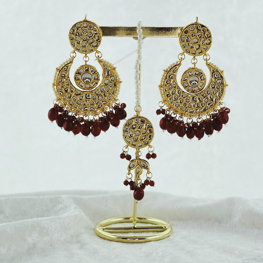 Tikka & earring set in maroon. High quality beads, pearls and stone work. Latest 2023 fashion for weddings, parties and special occasions