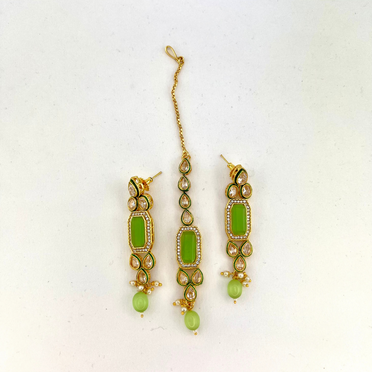 Necklace set with mint green beads and clear and mint green stones. Set includes necklace, tikka and earrings. Prefect for Indian weddings, parties and special occasions. Latest 2022 fashion. High end Indian fashion jewellery with top quality stones and beads.