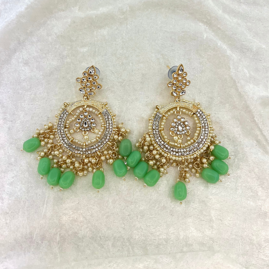 Indian wedding jewellery, earrings in mint green with pearls, stones and beads. latest 2022 fashion for indian weddings, parties and special occasion