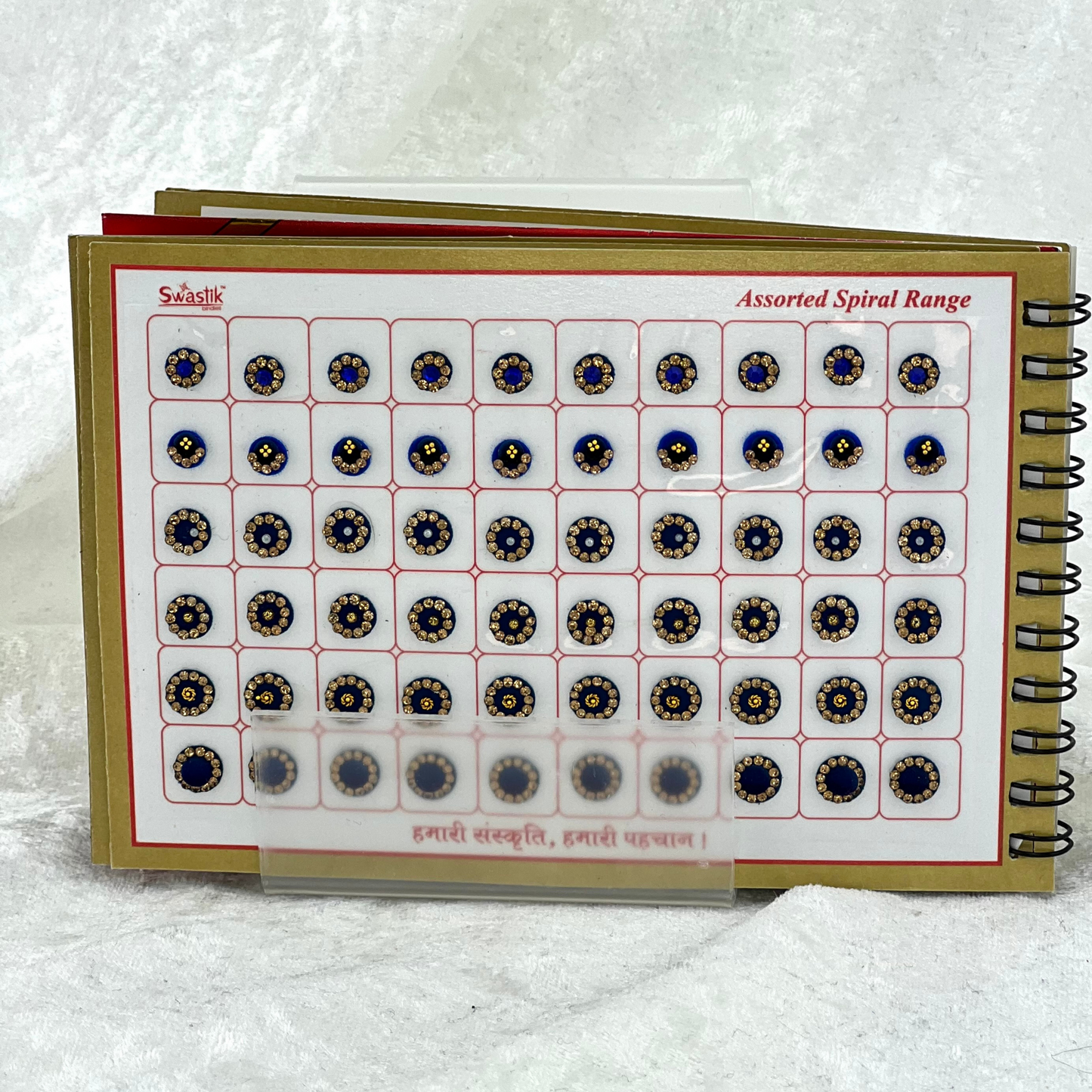 Bindi Book with gold stone work in round shape in various different sizes and colours. Prefect for Indian weddings, parties and special occasions.