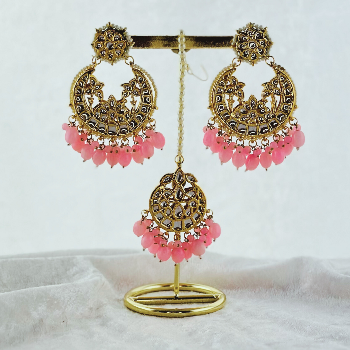Tikka & earring set in pink. High quality beads, pearls and stone work. Latest 2023 fashion for weddings, parties and special occasions