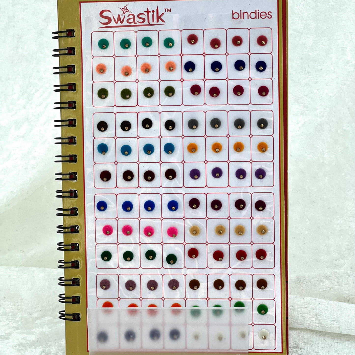 Bindi Book with single gold stone work in round shape in various different sizes and colours. Prefect for Indian weddings, parties and special occasions.