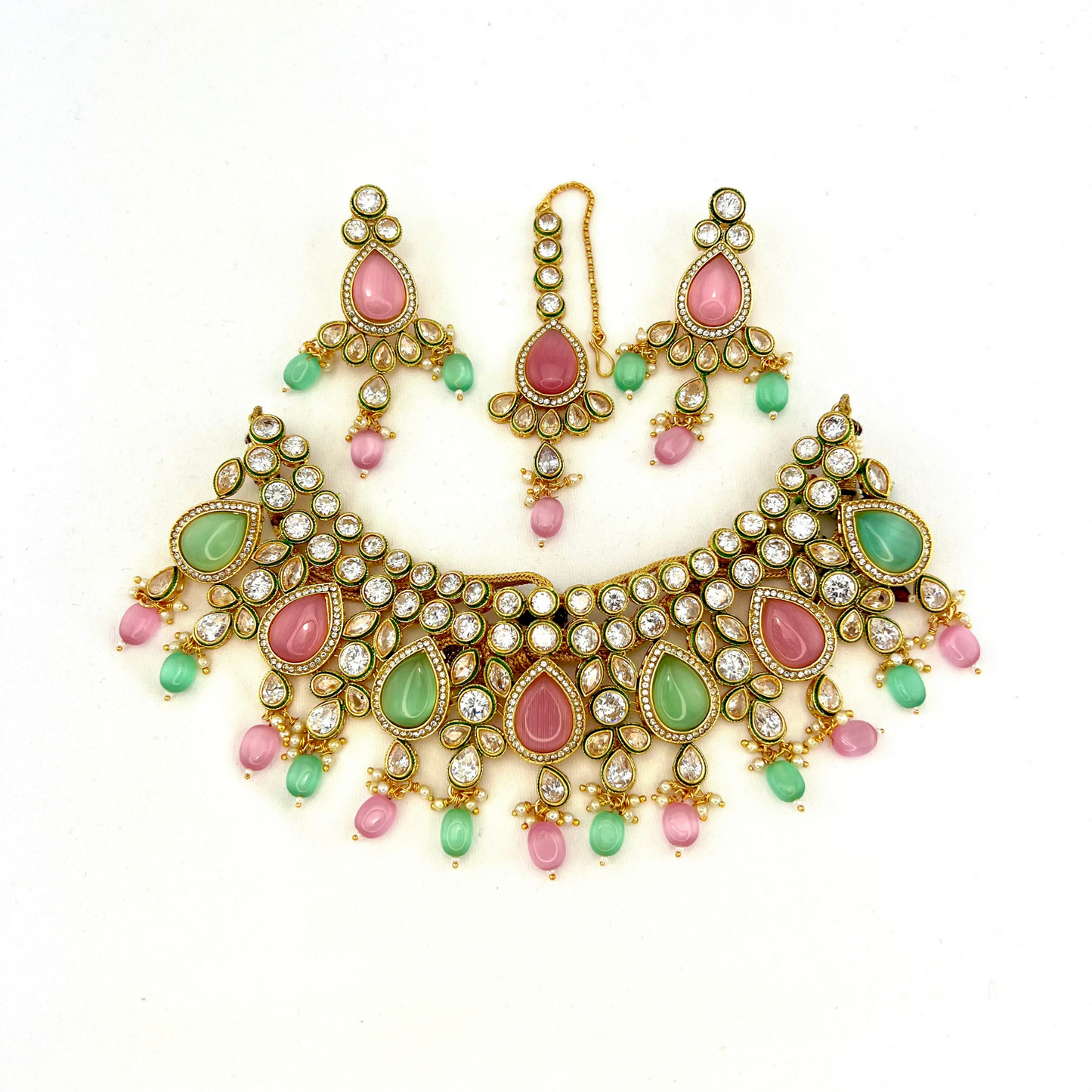 Necklace set with green, pink and clear stones and green and pink beads. Set includes necklace, tikka and earrings. Prefect for Indian weddings, parties and special occasions. Latest 2022 fashion. High end Indian fashion jewellery with top quality stones and beads.