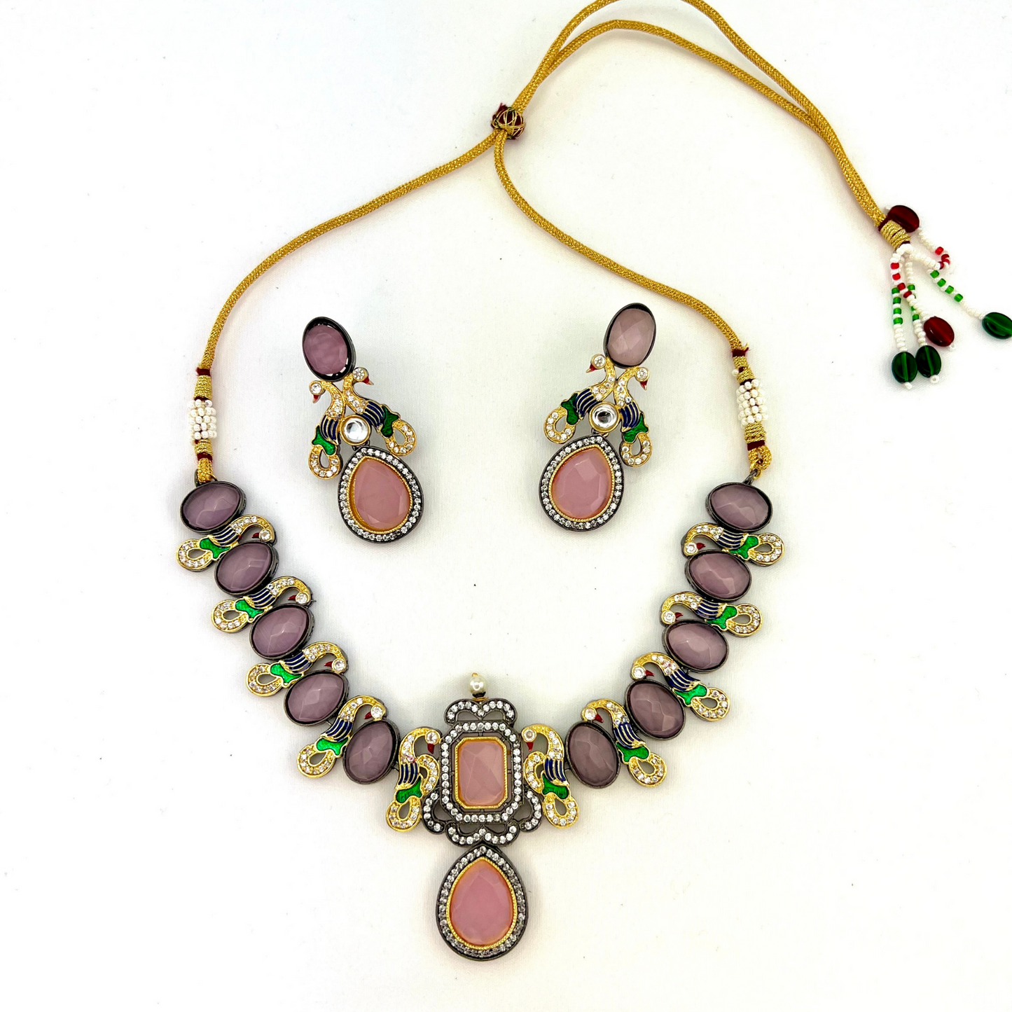 Necklace set with pink and purple clear stone work.  Set includes necklace and earrings.  Prefect for Indian weddings, parties and special occasions.  Latest 2022 fashion. High end Indian fashion jewellery with top quality stones and beads.