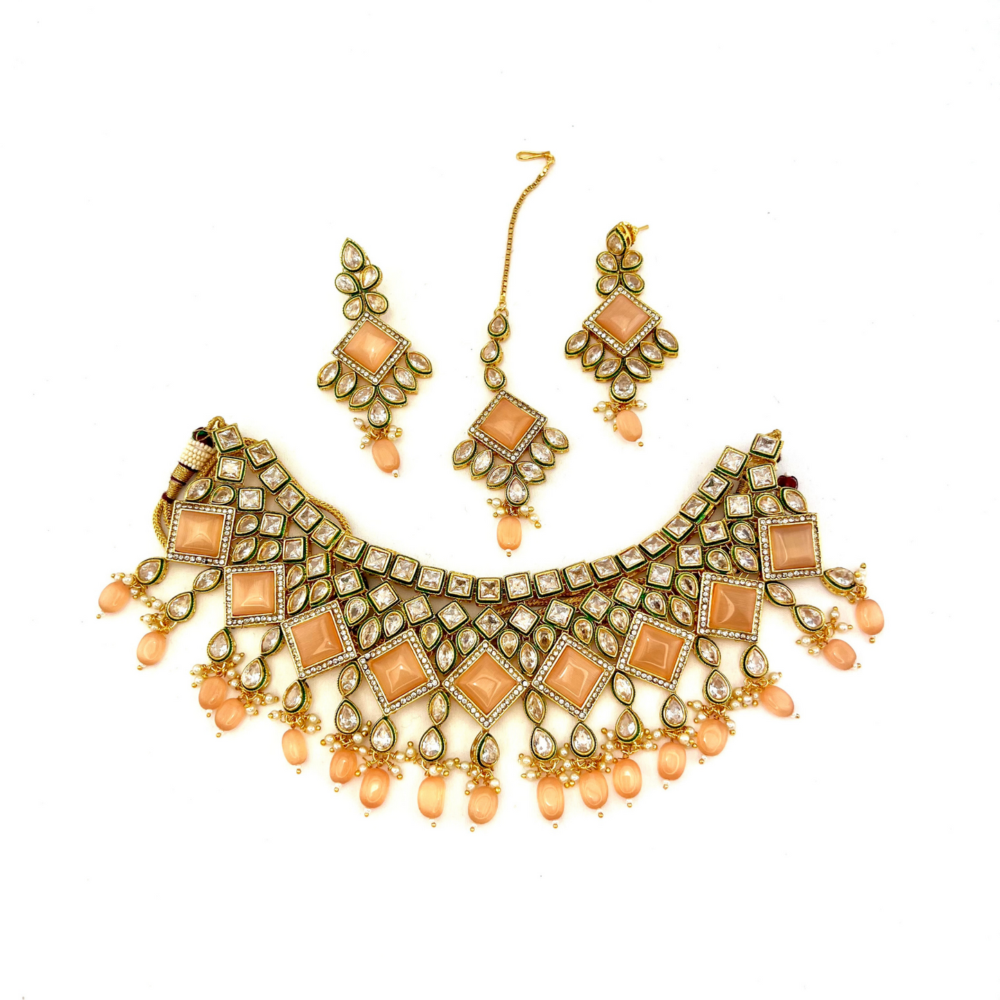 Necklace set with peach beads and peach and clear stone. Set includes necklace, tikka & earrings. Prefect for Indian weddings, parties and special occasions. Latest 2022 fashion. High end Indian fashion jewellery with top quality stones and beads.