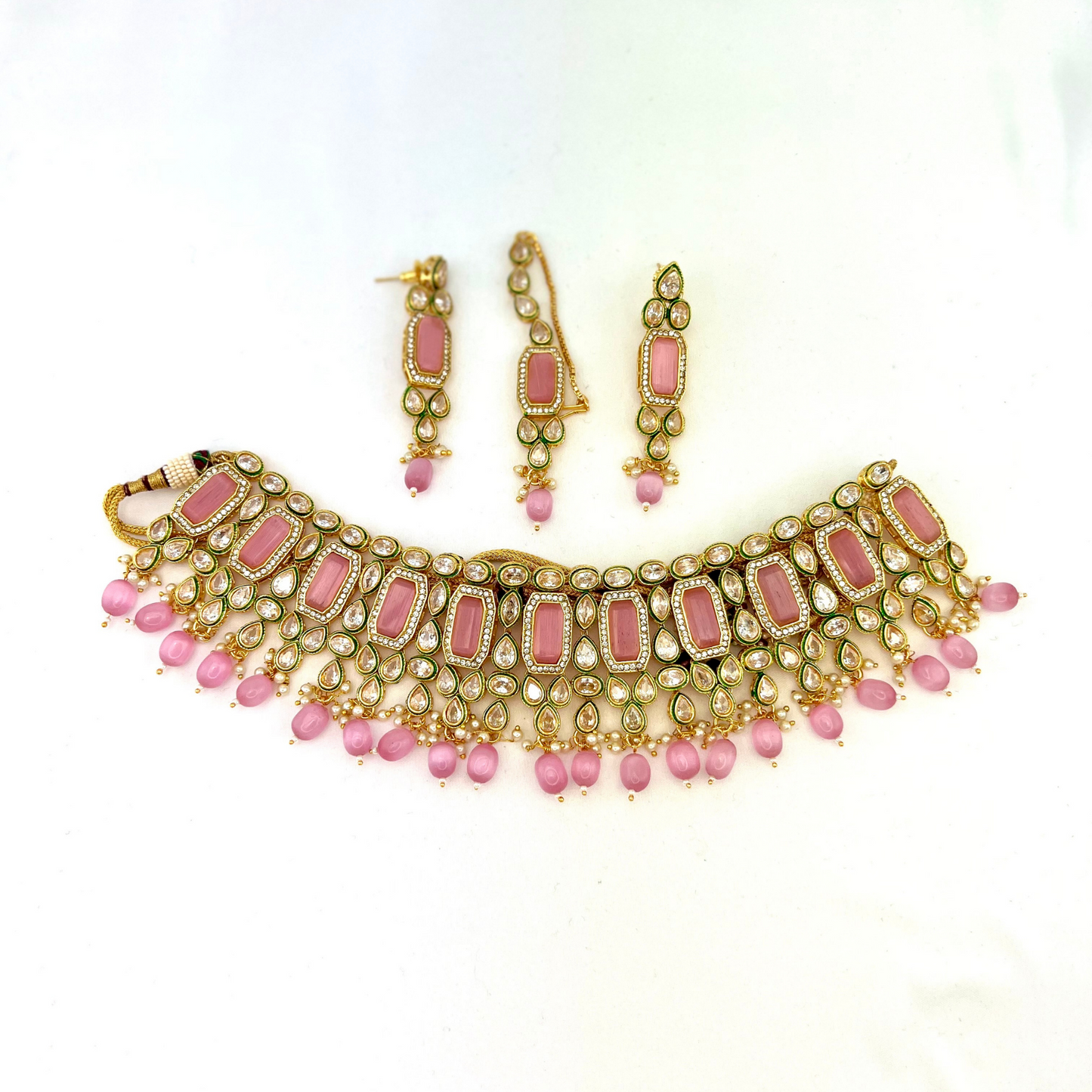 Necklace set with pink beads and clear and pink stones. Set includes necklace, tikka and earrings. Prefect for Indian weddings, parties and special occasions. Latest 2022 fashion. High end Indian fashion jewellery with top quality stones and beads.