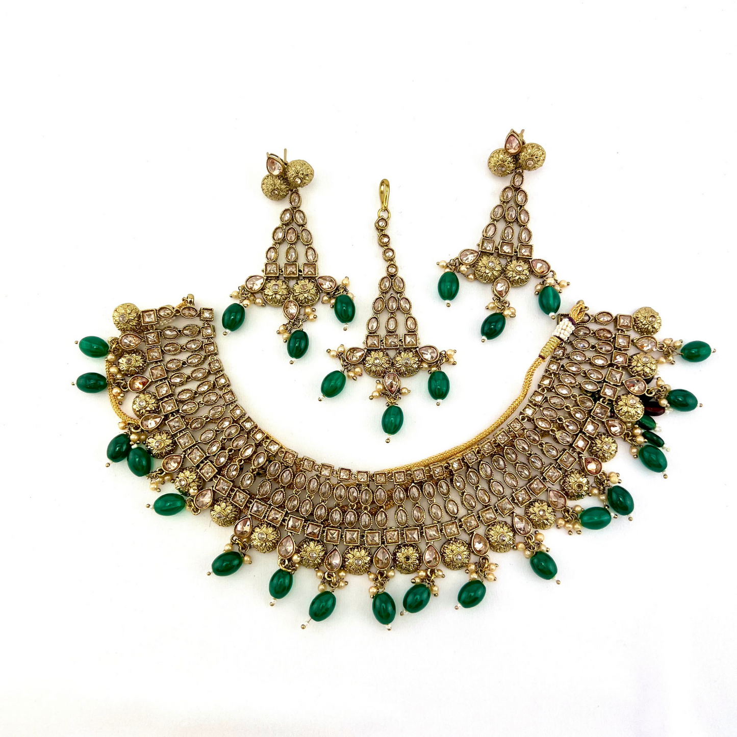 Necklace set with green beads and gold stone work. Set includes necklace, tikka and earrings. Prefect for Indian weddings, parties and special occasions. Latest 2022 fashion. High end Indian fashion jewellery with top quality stones and beads.