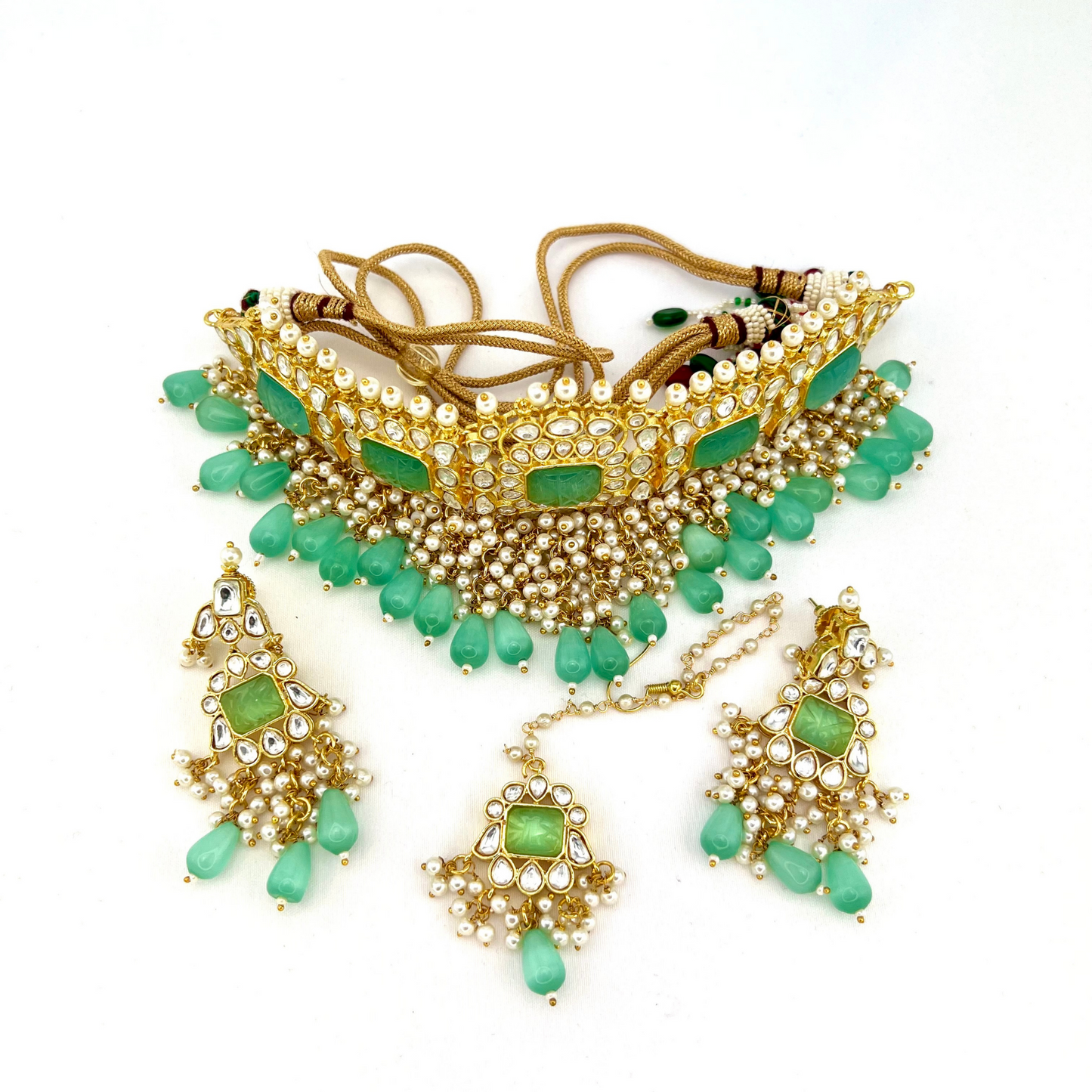Necklace set with turquoise beads and stones, finished with small white pearls. Set includes necklace, tikka and earrings. Prefect for Indian weddings, parties and special occasions. Latest 2022 fashion. High end Indian fashion jewellery with top quality stones and beads.