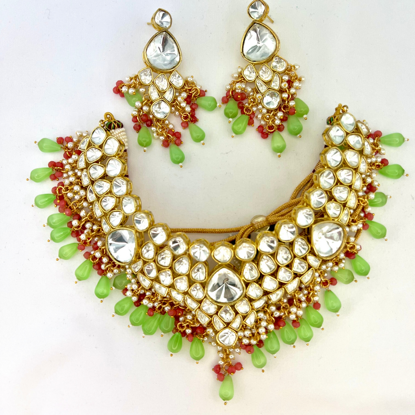 Kundan necklace set with with clear stones, green and pink beads. Set includes necklace and earrings. Prefect for Indian weddings, parties and special occasions. Latest 2022 fashion. High end Indian fashion jewellery with top quality stones and beads.