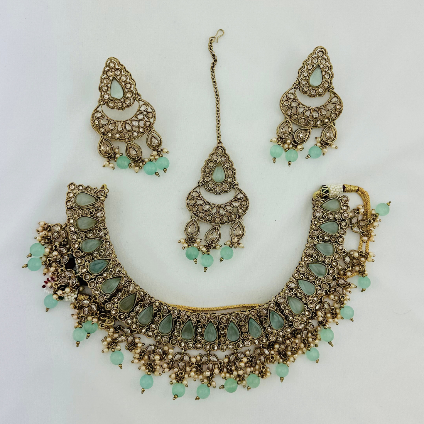 Necklace set with light blue beads and stone. Set includes necklace, tikka & earrings. Prefect for Indian weddings, parties and special occasions. Latest 2023 fashion. High end Indian fashion jewellery with top quality stones and beads.