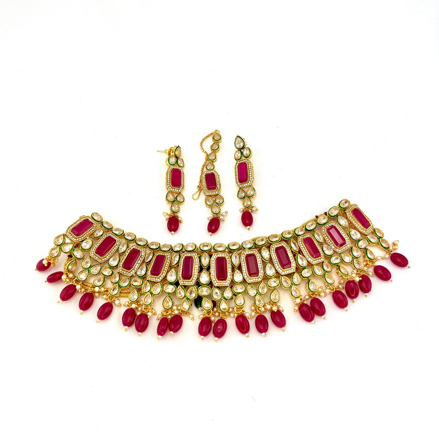 Necklace set with hot pink beads and clear and hot pink stones. Set includes necklace, tikka and earrings. Prefect for Indian weddings, parties and special occasions. Latest 2022 fashion. High end Indian fashion jewellery with top quality stones and beads.