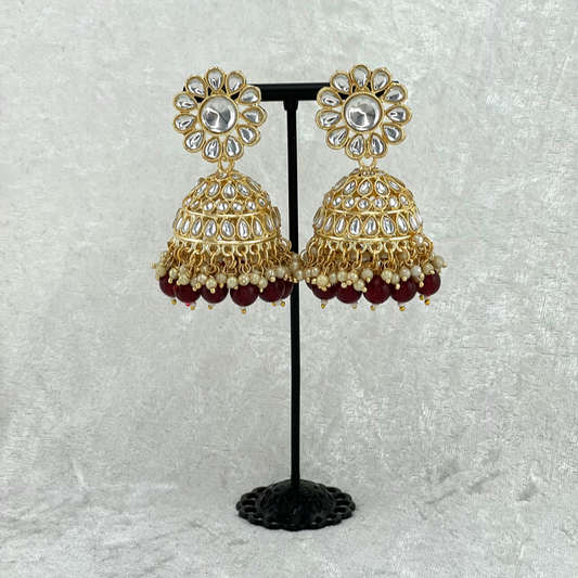 Jhumka earrings in Burgundy with stones, pearls and beads. Indian wedding jewellery prefect for weddings, parties and special occasions. latest high quality 2022 fashion