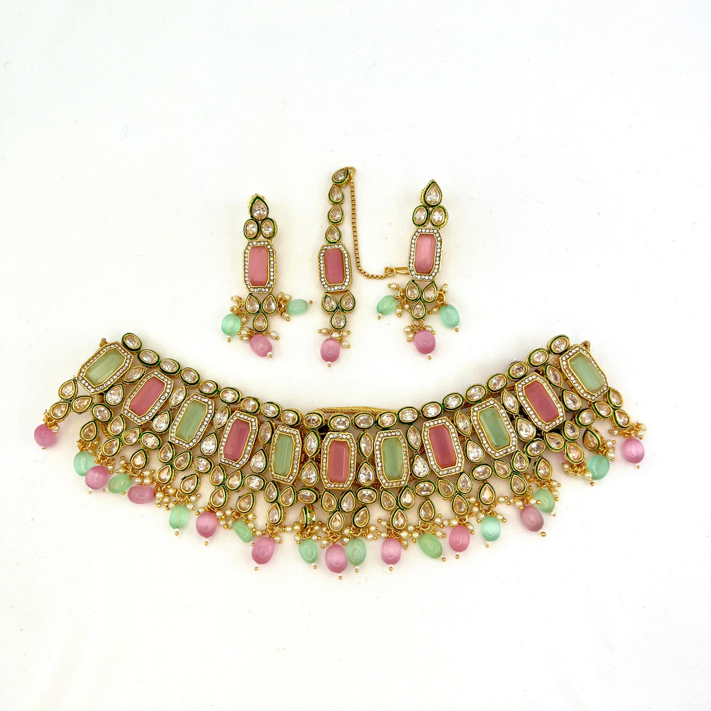 Necklace set with green, pink and clear stones and green and pink beads. Set includes necklace, tikka and earrings. Prefect for Indian weddings, parties and special occasions. Latest 2022 fashion. High end Indian fashion jewellery with top quality stones and beads.