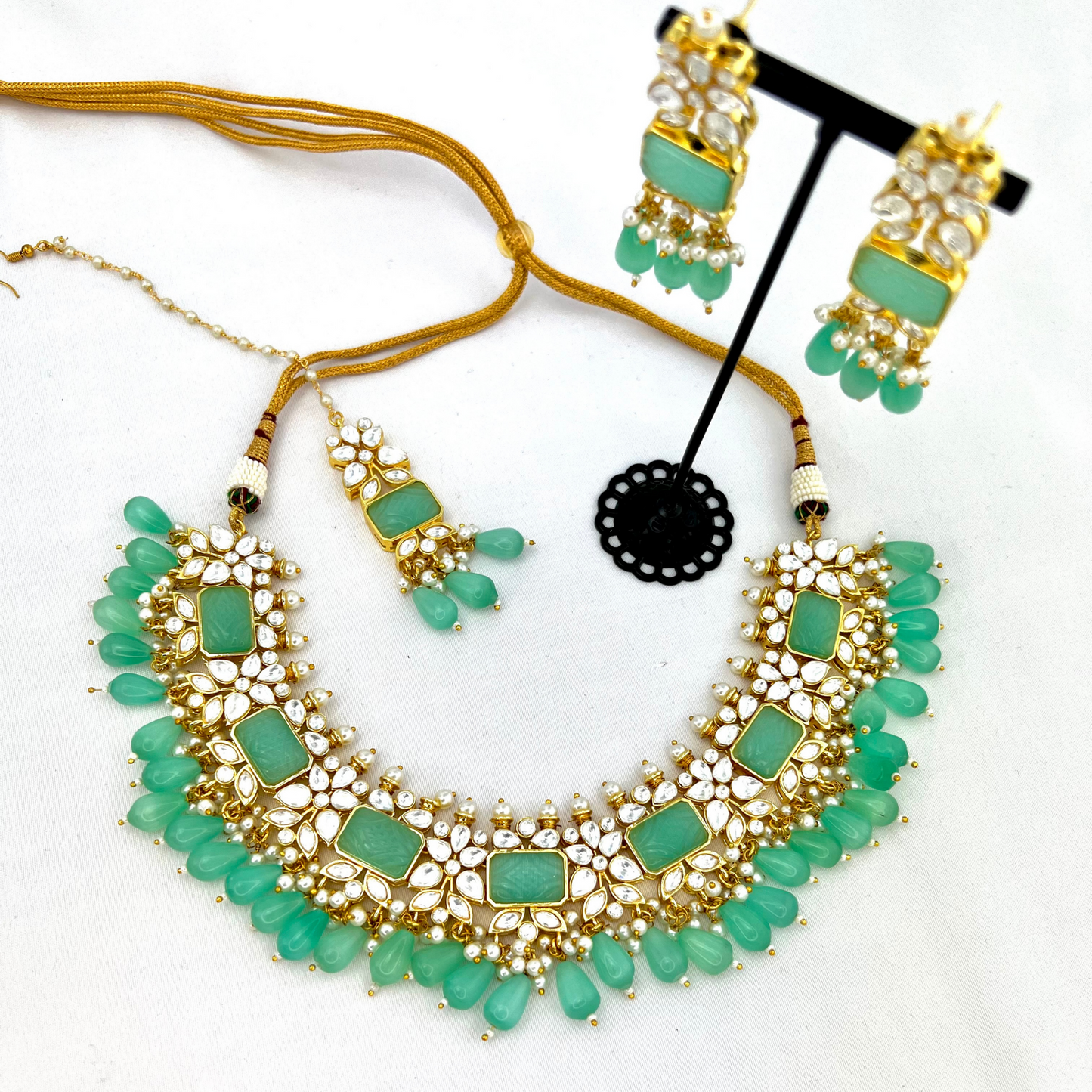 Necklace set with turquoise beads, clear and turquoise stones. Set includes necklace, tikka & earrings. Prefect for Indian weddings, parties and special occasions. Latest 2022 fashion. High end Indian fashion jewellery with top quality stones and beads.