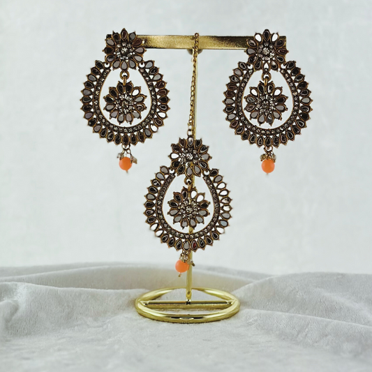 Tikka & earring set in peach. High quality beads, pearls and stone work. Latest 2023 fashion for weddings, parties and special occasions