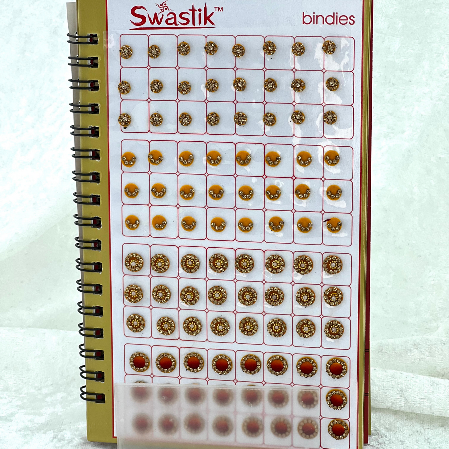 Bindi Book - Gold stone work in round shape in various different sizes and colours. Prefect for Indian weddings, parties and special occasions.