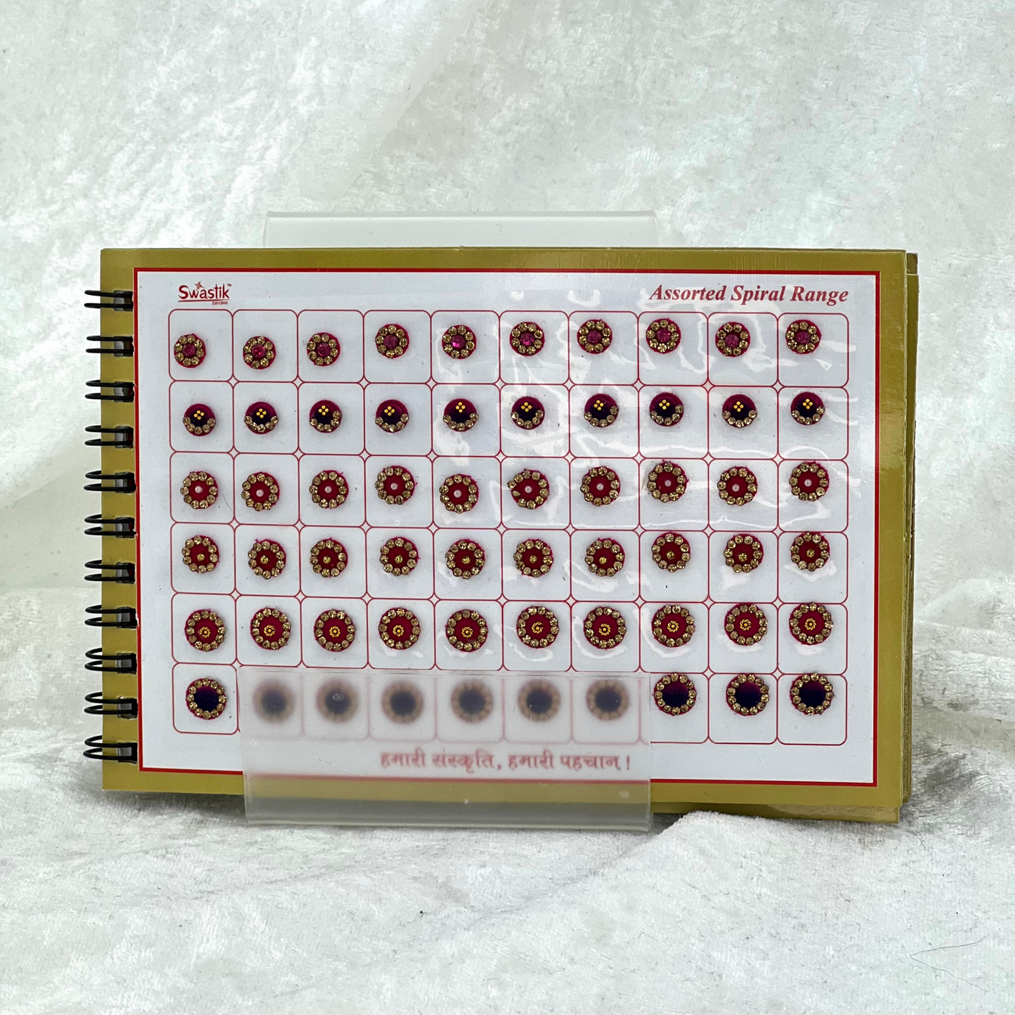 Bindi Book with gold stone work in round shape in various different sizes and colours. Prefect for Indian weddings, parties and special occasions.