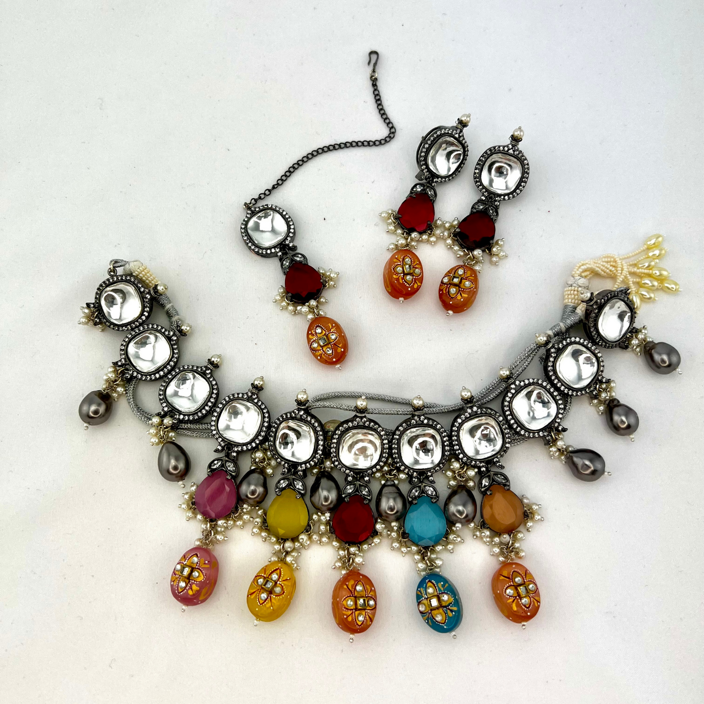 Kundan necklace set with multi colour stones and beads. Set includes necklace, tikka and earrings. Prefect for Indian parties, weddings and special occasions. Latest 2022 fashion