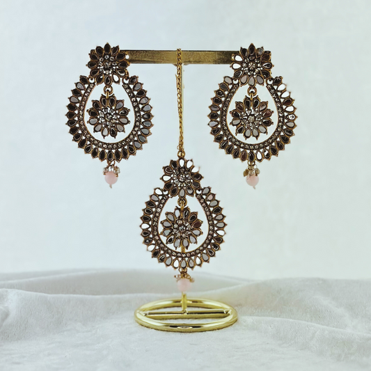 Tikka & earring set in baby pink. High quality beads, pearls and stone work. Latest 2023 fashion for weddings, parties and special occasions