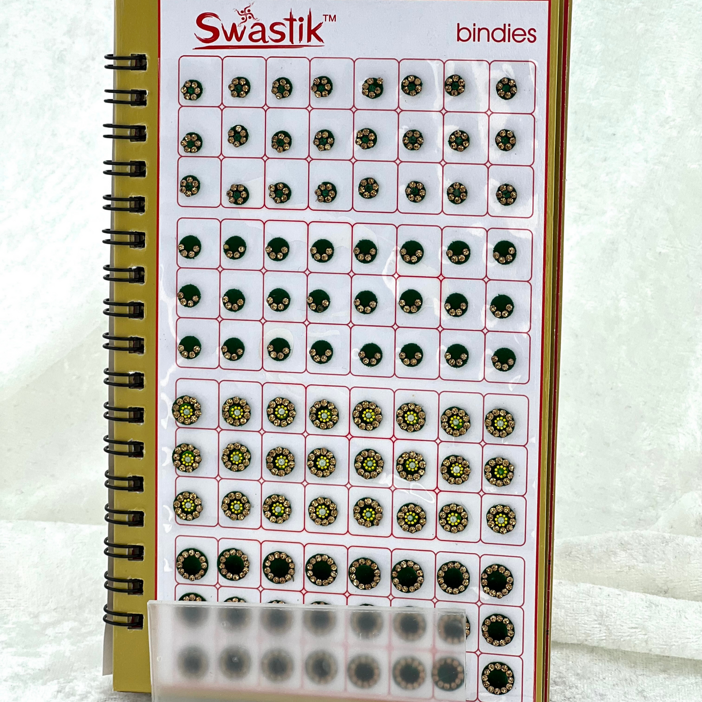 Bindi Book - Gold stone work in round shape in various different sizes and colours. Prefect for Indian weddings, parties and special occasions.