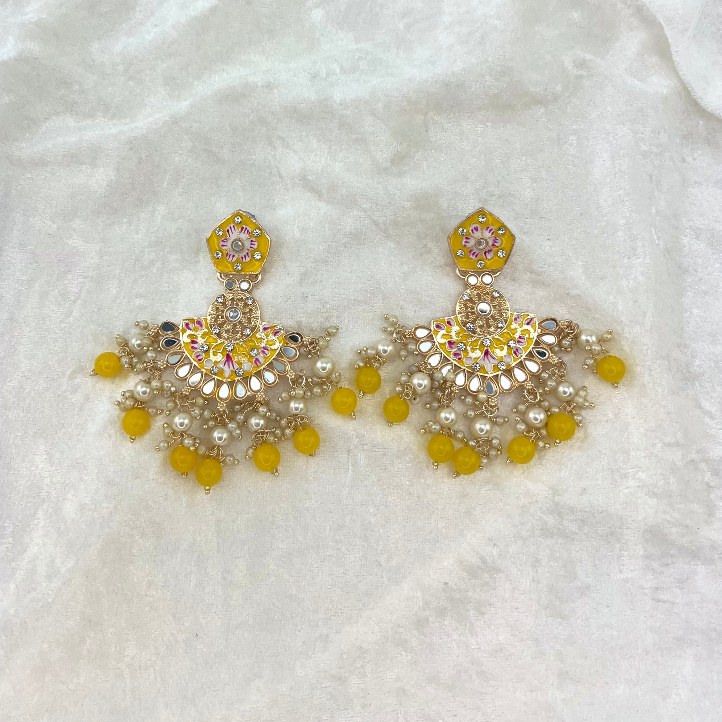 High quality hand painted earrings in Yellow with pearls, beads, mirrors and stone work. Latest 2022 indian jewellery for weddings, parties and special occasions.