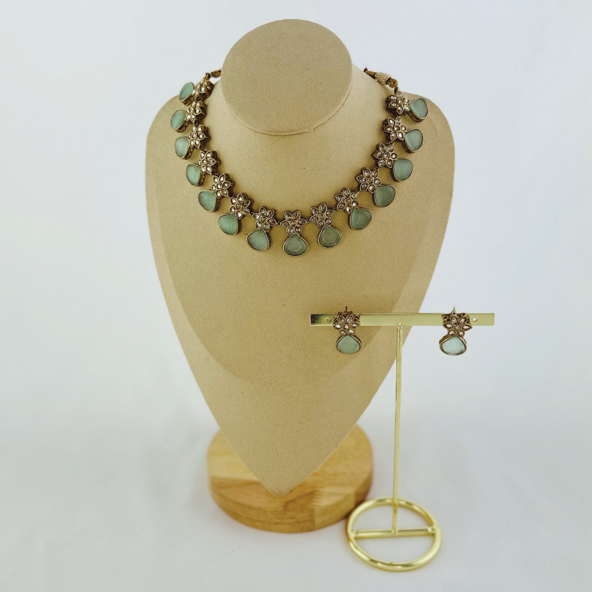 Necklace set with light blue stones.  Set includes necklace & earrings.  Prefect for Indian weddings, parties and special occasions.   Latest 2023 fashion. High end Indian fashion jewellery with top quality stones and beads.