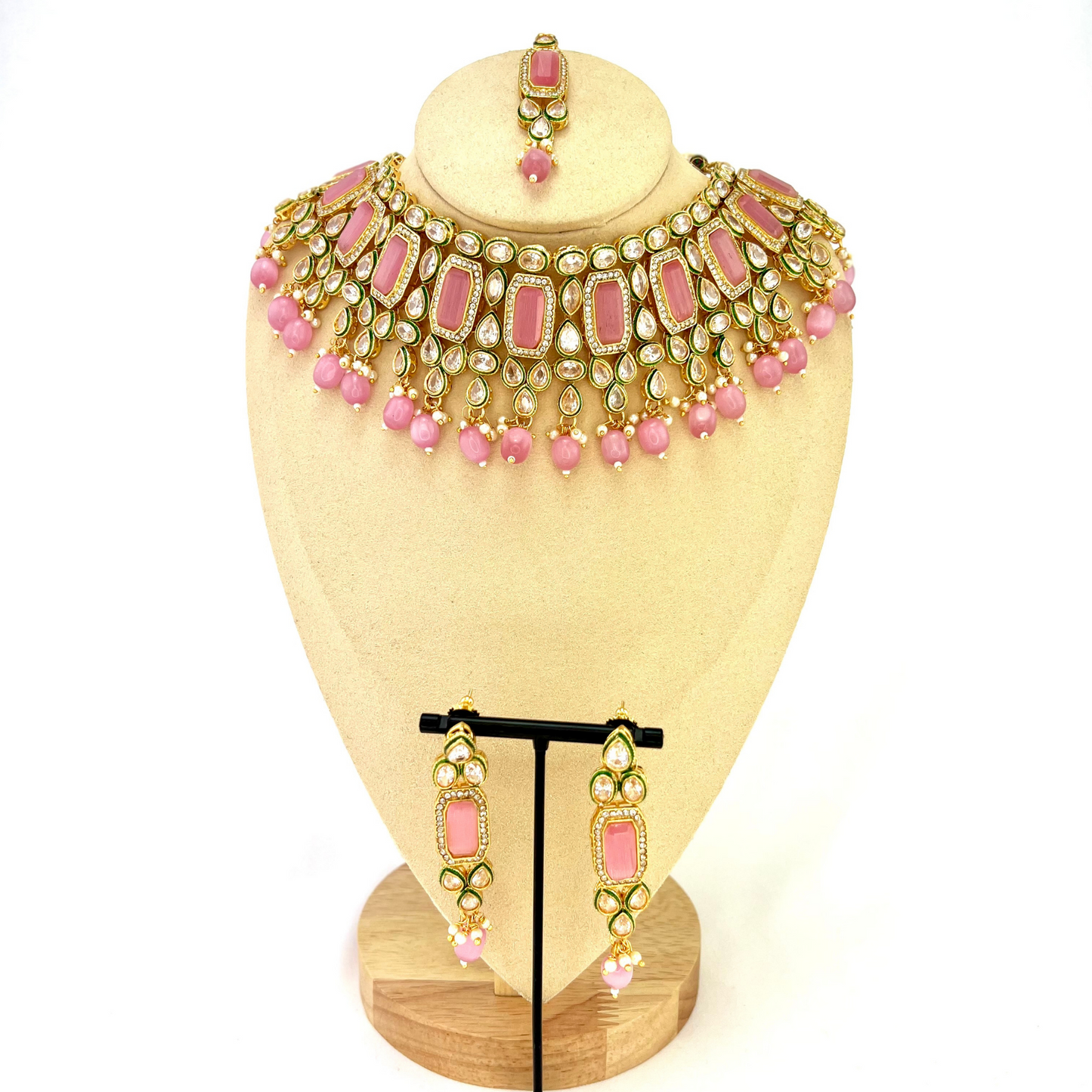 Necklace set with pink beads and clear and pink stones.  Set includes necklace, tikka and earrings.  Prefect for Indian weddings, parties and special occasions.  Latest 2022 fashion. High end Indian fashion jewellery with top quality stones and beads.