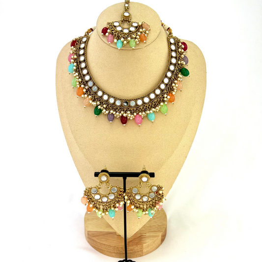 Mirror necklace set with multi colour beads and small pearls.  Set includes necklace, tikka and earrings.  Prefect for Indian parties, weddings and special occasions.   Latest 2022 fashion 