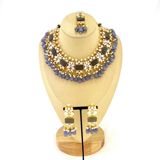 Necklace set with lavender beads, clear and lavender stones.  Set includes necklace, tikka & earrings.  Prefect for Indian weddings, parties and special occasions.   Latest 2022 fashion. High end Indian fashion jewellery with top quality stones and beads.