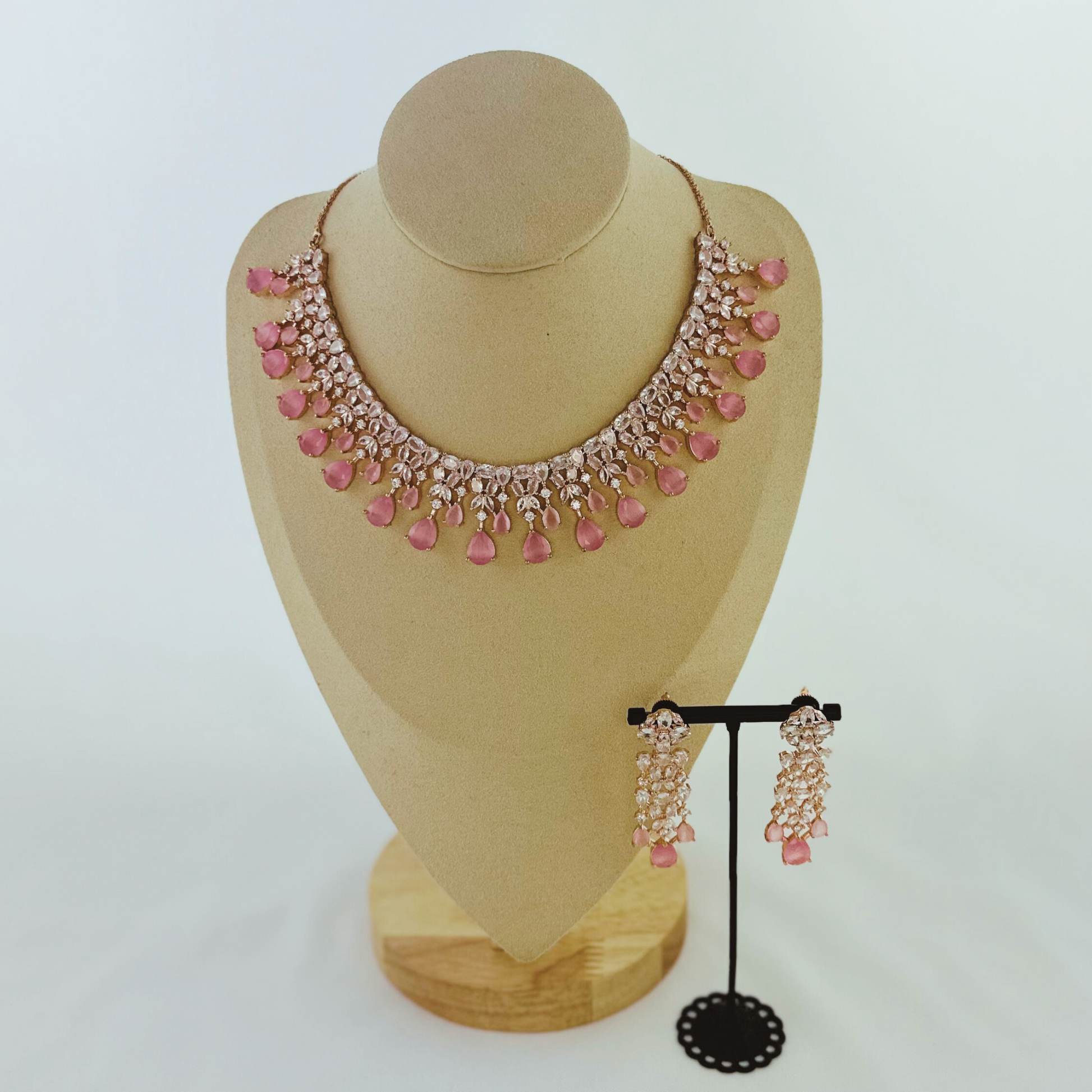 Rosegold necklace set with clear and pink stones.  Set includes necklace & earrings.  Prefect for Indian weddings, parties and special occasions.   Latest 2023 fashion. High end Indian fashion jewellery with top quality stones and beads.